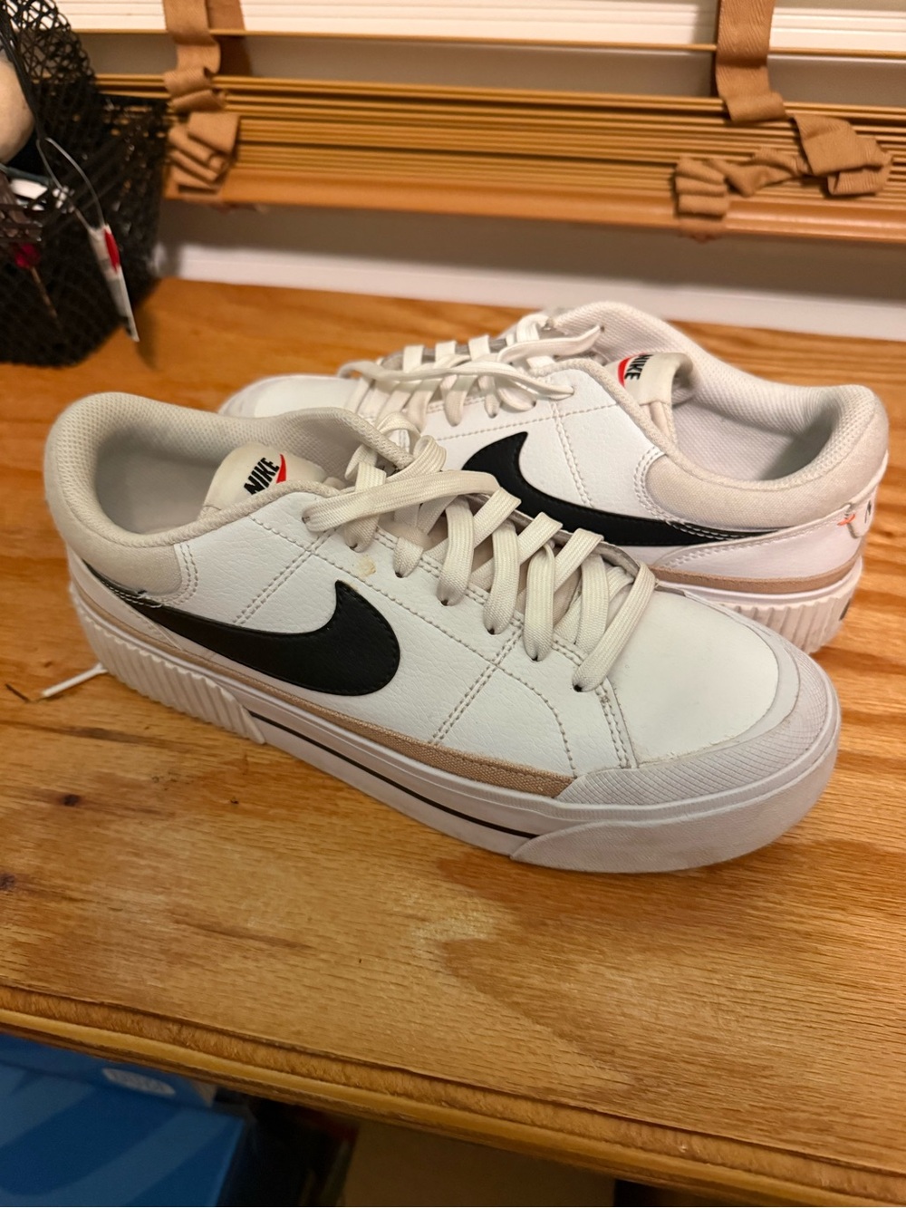 Nike White Sneakers with Black Swoosh and Tan Accent